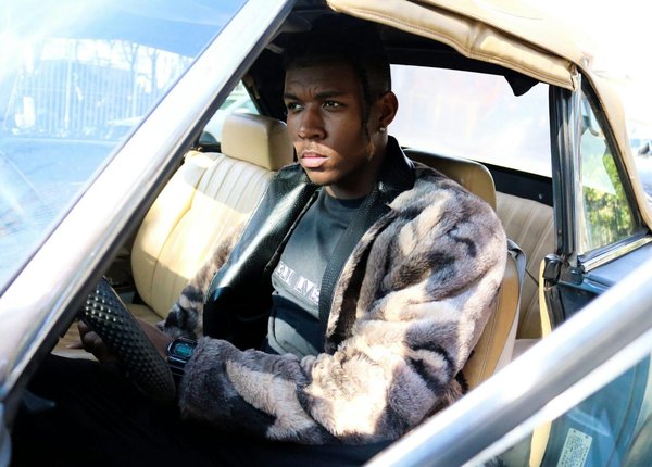 How are UK car manufacturers improving sustainability through AI?